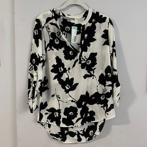Chic, versatile black & white blouse by Daniel Rainnz.